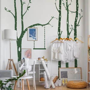 Detail of Nordic style green tree wall sticker with swing in a modern minimalist living room