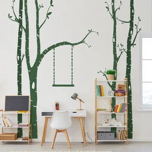 Detail of minimalist dark green tree and swing wall decal in a cozy home office setting