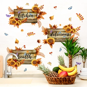 Detail of sunflower kitchen wall stickers featuring maple leaves and delicious health text