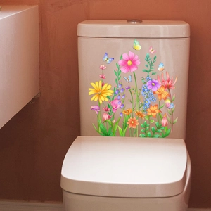 Detailed view of floral and butterfly waterproof stickers on a white toilet water tank