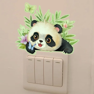 Detailed close-up of a luminous cartoon panda wall sticker on a light beige wall surface