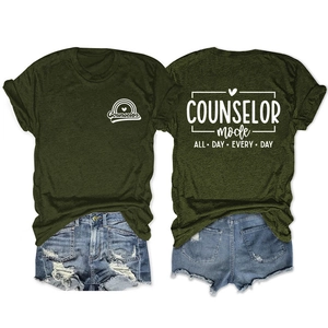 Flat lay showing front and back of army green counselor t-shirt with denim shorts