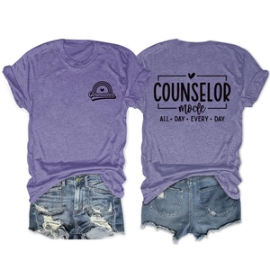 Flat lay of purple counselor mode graphic T-shirt and distressed denim shorts set
