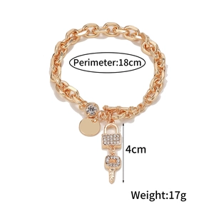 Golden alloy chain bracelet with sparkling lock and key charms, 18cm length with OT clasp