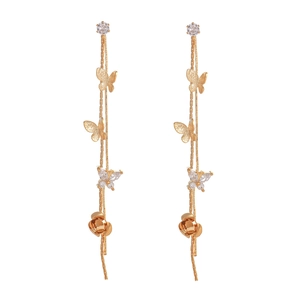 Detailed close-up of golden tassel earrings featuring zircon butterflies and rose buds