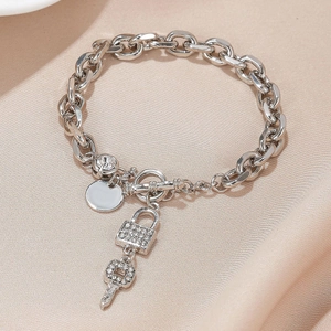 Silver alloy braided chain bracelet with pave rhinestone lock and key charms with OT clasp