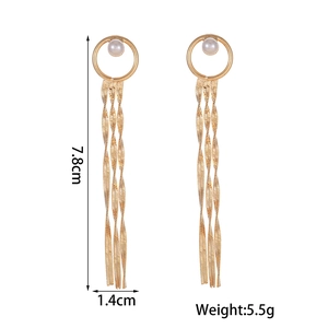 Detail showing long tassel flower earrings with dimensions 7.8cm length and 5.5g weight