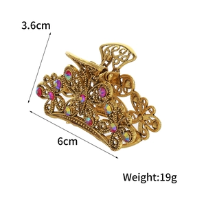 Vintage gold butterfly hair claw clip with colorful rhinestones and floral hollow design