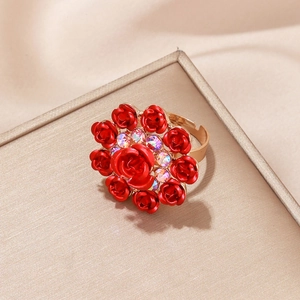Elegant gold adjustable ring featuring red rose blossoms and sparkling rhinestones