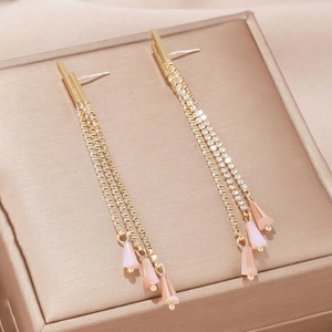 Elegant long gold tassel earrings with sparkling rhinestones and pink floral petal drops