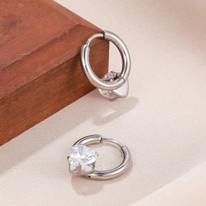 Elegant silver-colored alloy hoop earrings featuring large heart-shaped cubic zirconia