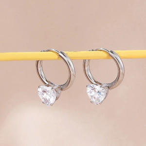 Minimalist silver-toned alloy hoop earrings with sparkling heart-shaped zircon pendants