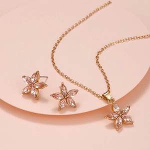 Elegant gold necklace and stud earrings set with pink marquise crystal flower petals