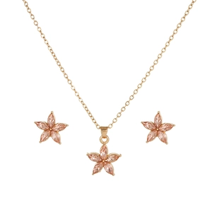 Star-shaped necklace and earrings set with pink marquise crystals in gold finish