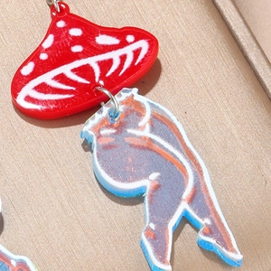 Acrylic mushroom earrings with iridescent laser-cut woman legs in pop art style