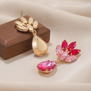 Pink teardrop earrings with crystals on gold alloy base shown from front and back views