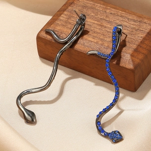 Elegant asymmetrical snake drop earrings in gunmetal finish with sparkling blue crystals