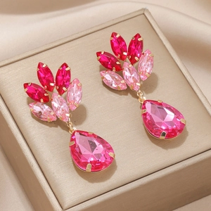 Pink teardrop drop earrings with gradient crystals and gold plating on champagne silk