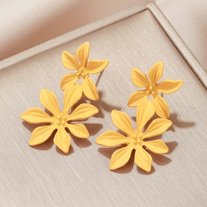 Chic yellow floral earrings with matte finish and glass crystals in a jewelry box