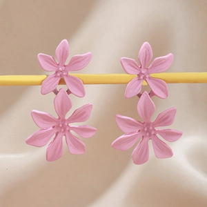 Pink floral layered earrings with matte finish and glass crystal detail on display