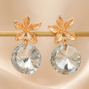 Elegant gold flower earrings with a large multifaceted crystal droplet in a 5-petal design