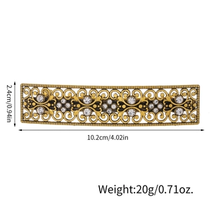 Vintage filigree hair clip with rhinestones, measuring 10.2cm in length and 2.4cm in width