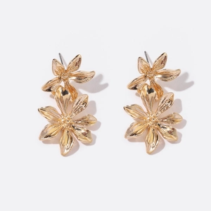 Elegant gold flower stud earrings with layered textured petals and centered stamen