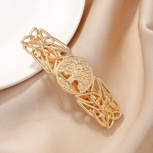 Golden Tree of Life hair clip with Celtic knot hollow pattern on silk background