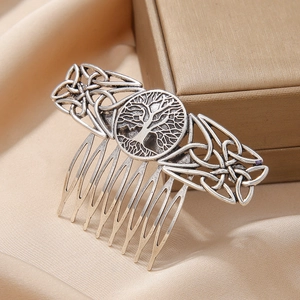 Vintage silver alloy hair comb with Celtic knot tree of life on champagne silk fabric