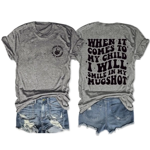 Front and back view of casual grey t-shirt with quotes and frayed denim shorts