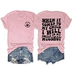 Front and back view of a pink casual T-shirt with graphic print and denim shorts