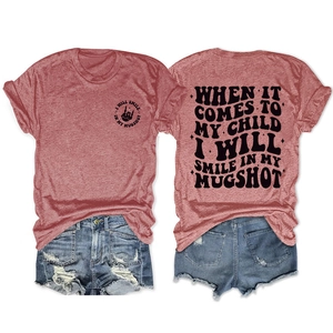Front and back view of a pink T-shirt with 'My Mugshot' slogan and denim shorts