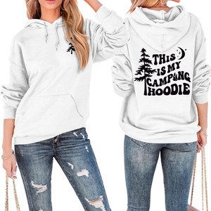 Detailed view of white camping hoodie showing front pine logo and back graphic print
