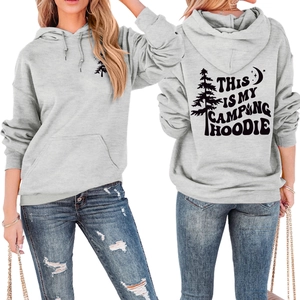 Detail of grey camping hoodie with black pine and moon graphic print and front pocket