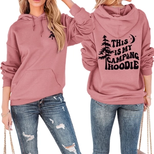 Detail view of the camping graphics and campfire print on this dusty rose hoodie