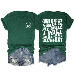 Detailed back print of a green t-shirt with retro white artistic lettering and motifs
