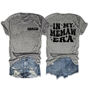 Front and back view of gray Memaw Era T-shirt with black bubble font text and star patterns