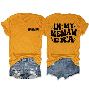 Detailed front and back view of ginger yellow cotton t-shirt with Memaw Era graphics