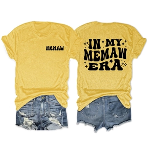 Bright yellow Memaw Era T-shirt featuring double-sided black graphic prints and star details