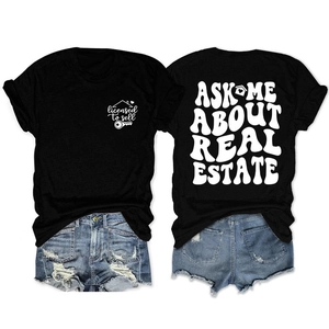 Detail of double-sided real estate print on black cotton T-shirt and denim shorts