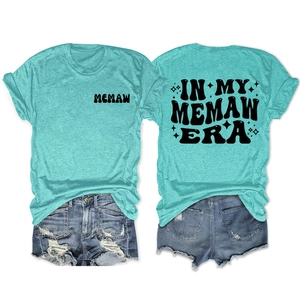 Detailed front and back view of mint green Memaw Era t-shirt with blue denim shorts