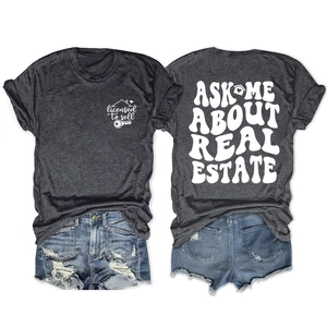 Front and back view of Ask Me About Real Estate charcoal t-shirt with ripped denim shorts