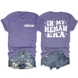 Detail of purple cotton blend t-shirt with retro Memaw era graphic print and denim shorts