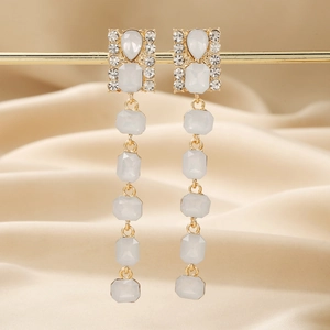 Elegant gold-tone long tassel earrings with sparkling rhinestones and drop-shaped gems