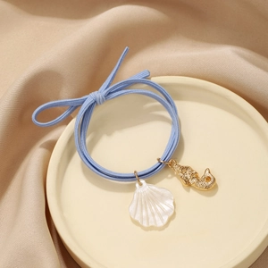 Light blue ocean style elastic hair tie with seashell and golden seahorse pendants