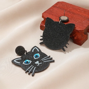 Cute Halloween black cat glitter acrylic stud earrings for women on champagne silk fabric