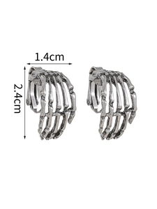 Detailed view of silver gothic skeleton hand earrings with 1.4cm x 2.4cm measurements