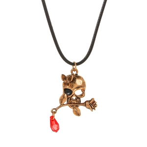 Detail of gothic skull necklace with rose, butterfly, and red crystal on black cord