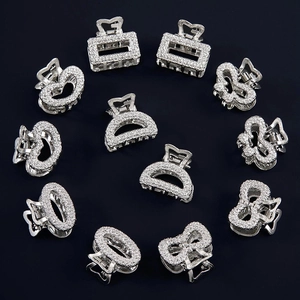 Set of 11 mini silver metal hair claws with sparkling white rhinestones in various shapes
