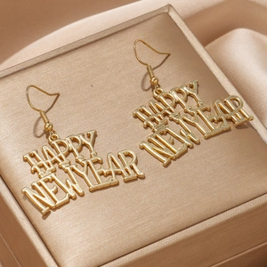 Boucles d'oreilles dorées Happy New Year sur fond en soie pour les fêtes